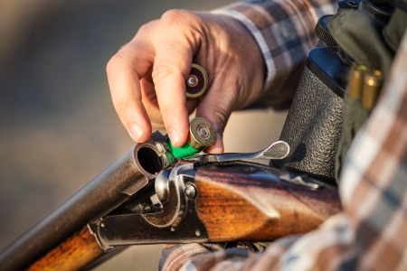 Turkey hunter loading shotgun