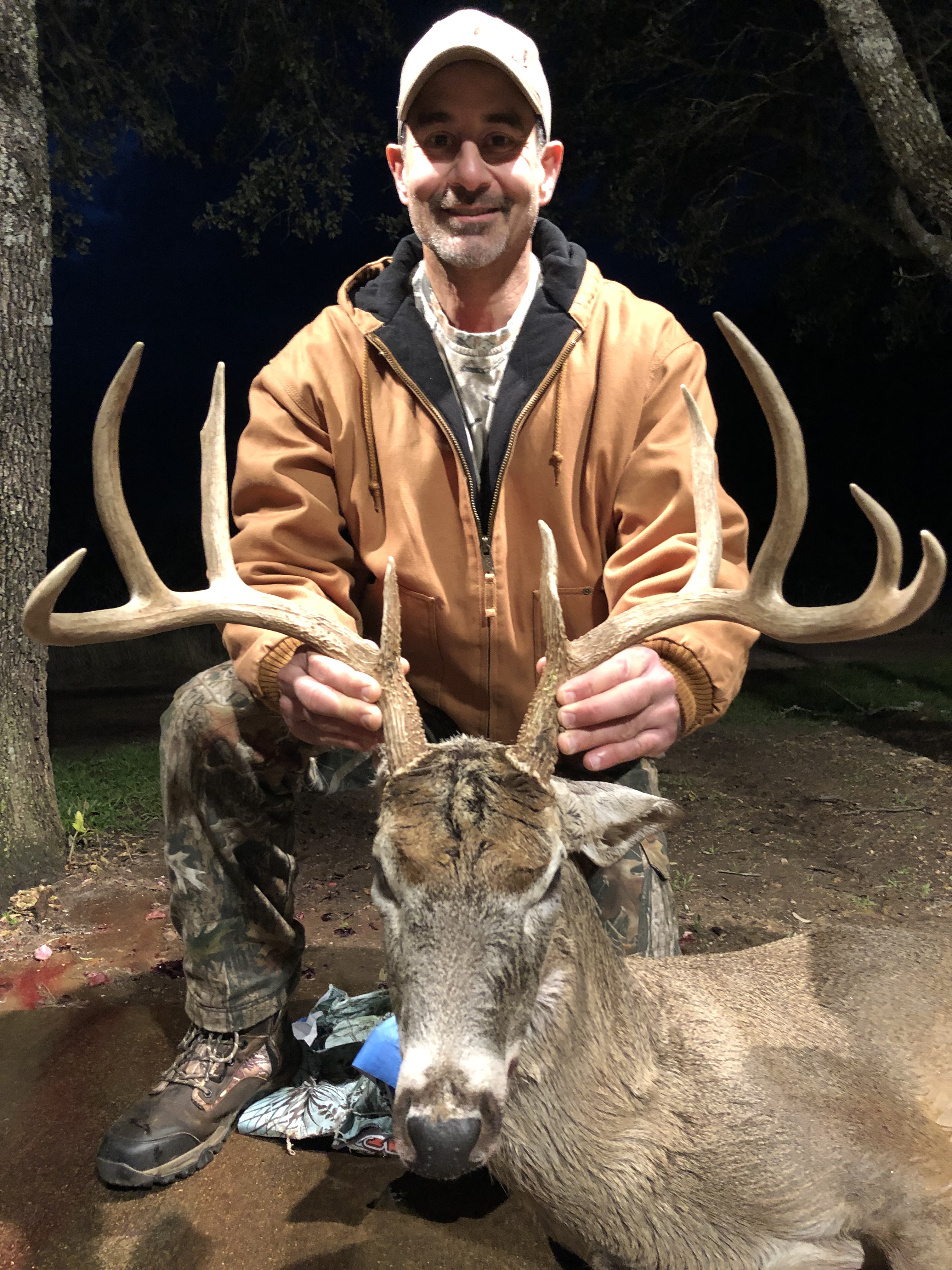 Hunter with a whitetail trophy in texas