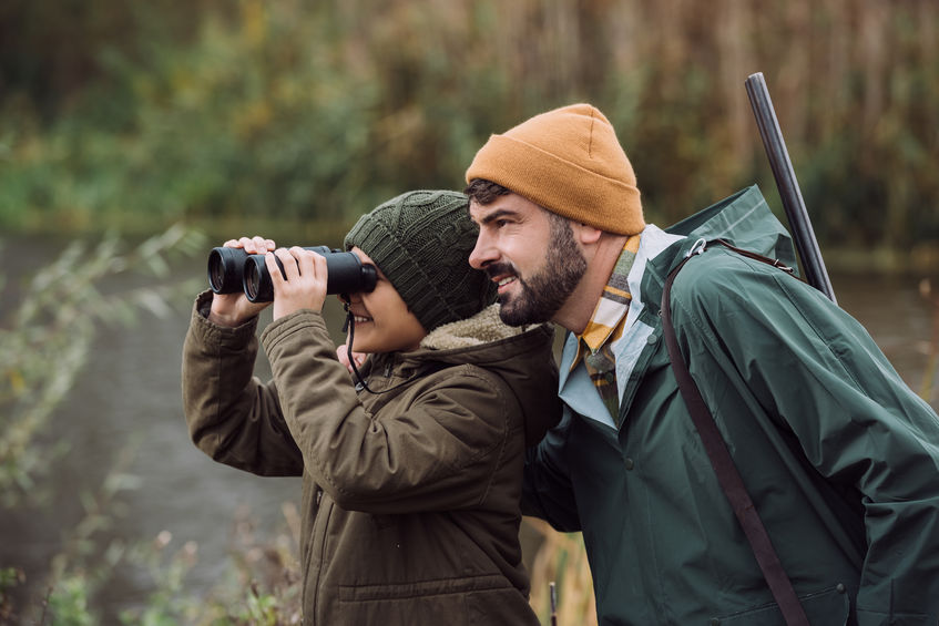 Father and son hunting whitetail deer in Texas